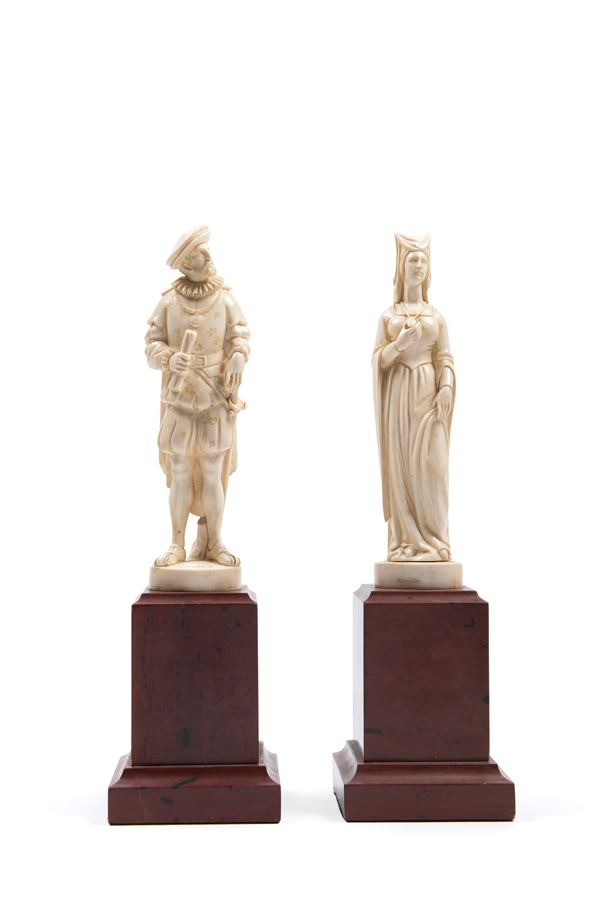 ☼IVORY SCULPTURES DEPICTING A GALLANT COUPLE IN RENAISSANCE ATTIRE ON RED MARBLE BASES