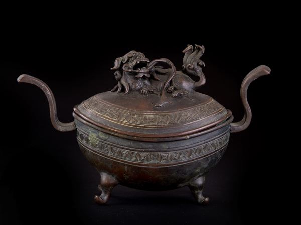 A SMALL BRONZE CENSER AND COVER
