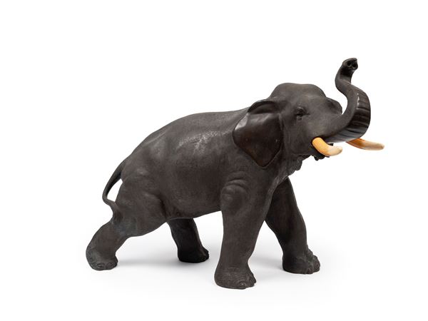 ☼A BRONZE OKIMONO WITH IVORY DETAILS