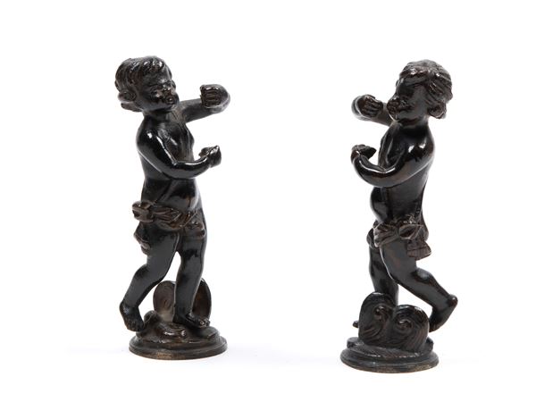 PAIR OF BRONZE PUTTI WITH DARK PATINA