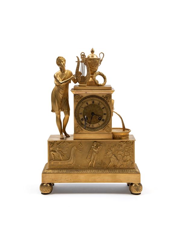 EMPIRE MANTEL CLOCK IN GILT BRONZE