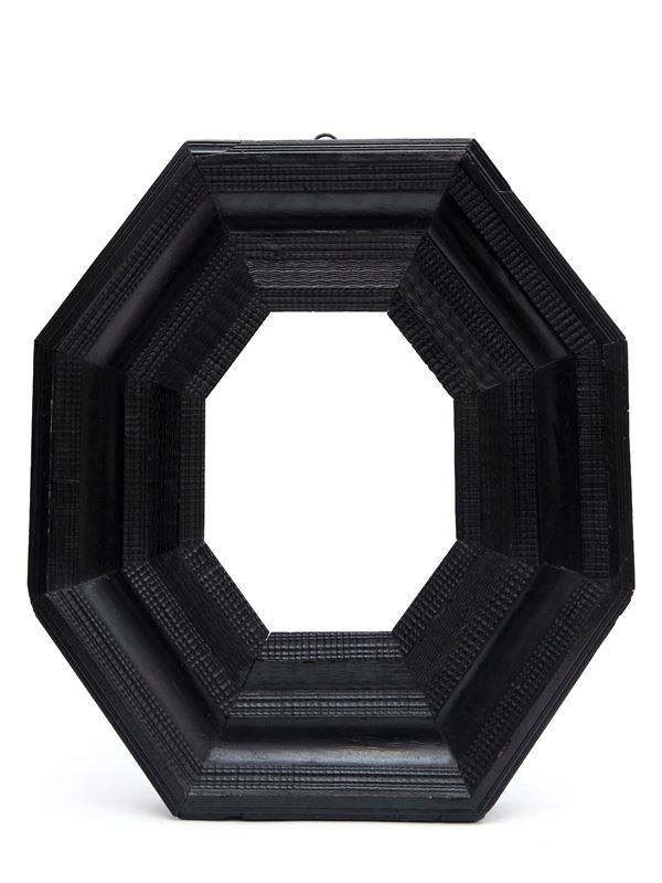 OCTAGONAL EBONIZED WOODEN FRAME WITH GUILLOCHE PATTERN