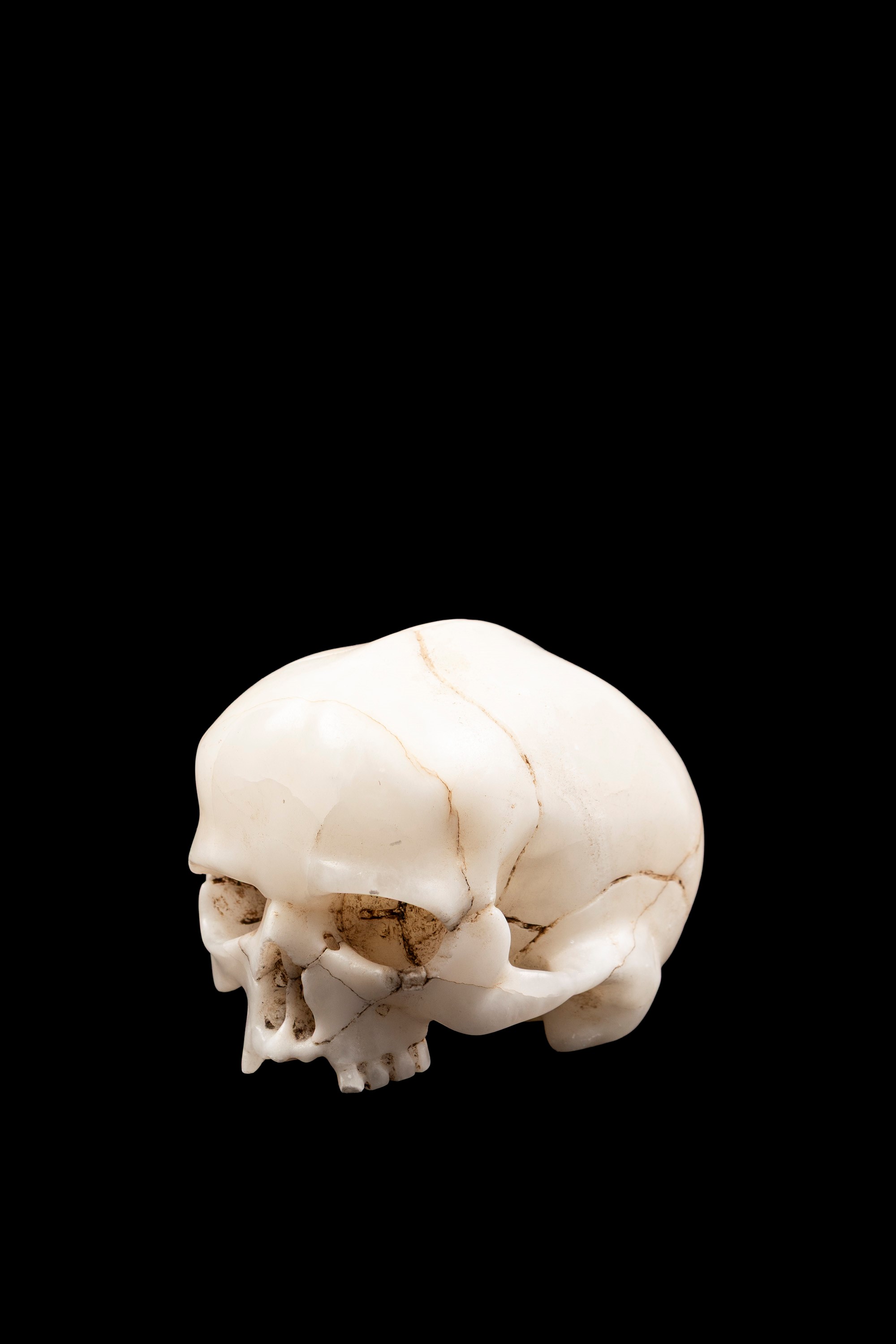 Memento mori in alabastro, teschio con volto sofferente in urlo, Germania XVII secolo