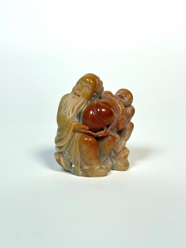 A SOAPSTONE SCULPTURE