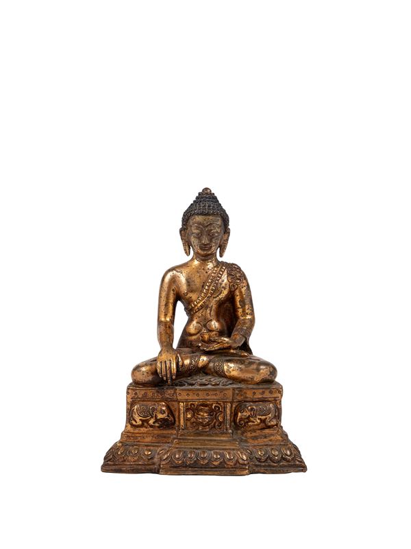 A GILT BRONZE FIGURE OF SHAKYAMUNI BUDDHA