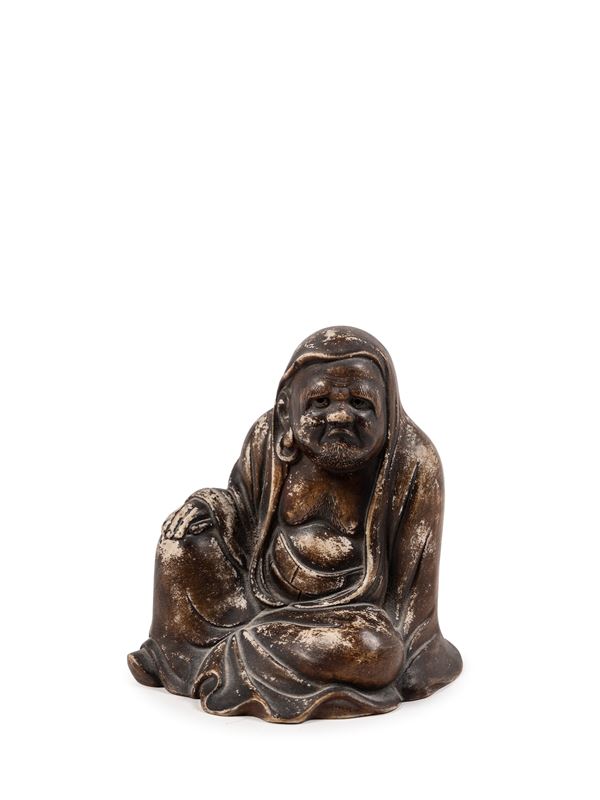 A CERAMIC FIGURE