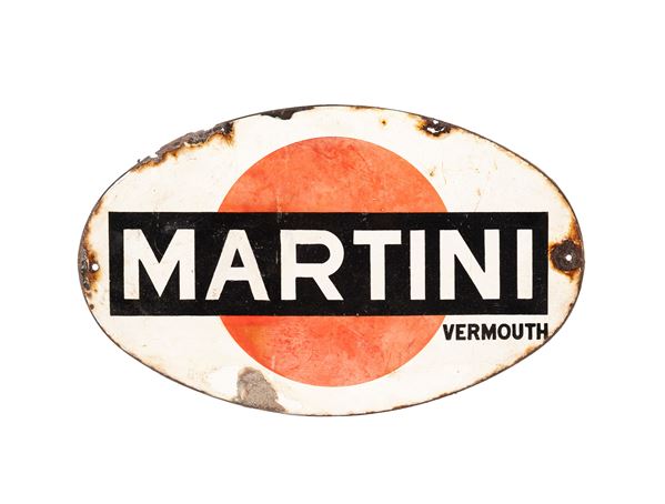 AN OVAL METAL MARTINI VERMOUTH ADVERTISING SIGN