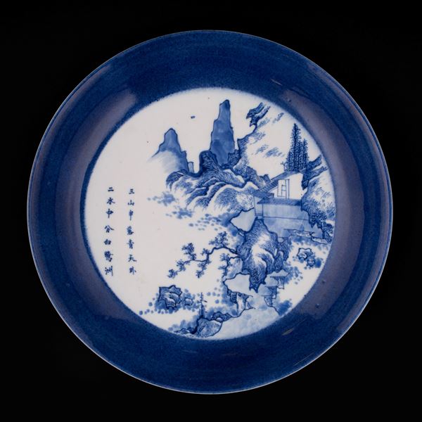 A BLUE AND WHITE DISH