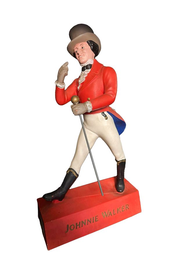 A JOHNNIE WALKER WINDOW DISPLAY ADVERTISING FIGURE