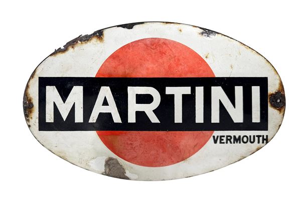 AN OVAL METAL MARTINI VERMOUTH ADVERTISING SIGN