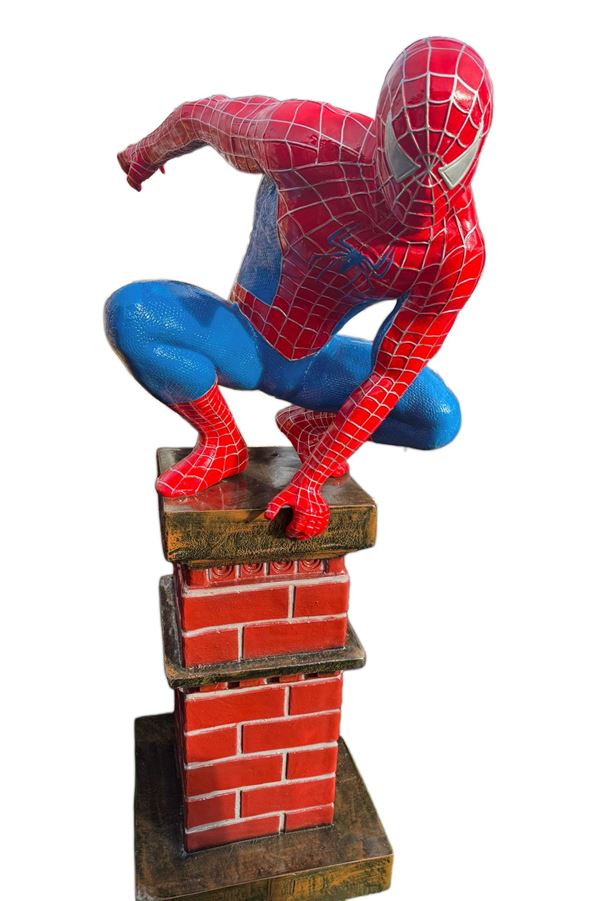 A SPIDERMAN FIGURE ON A CHIMNEY