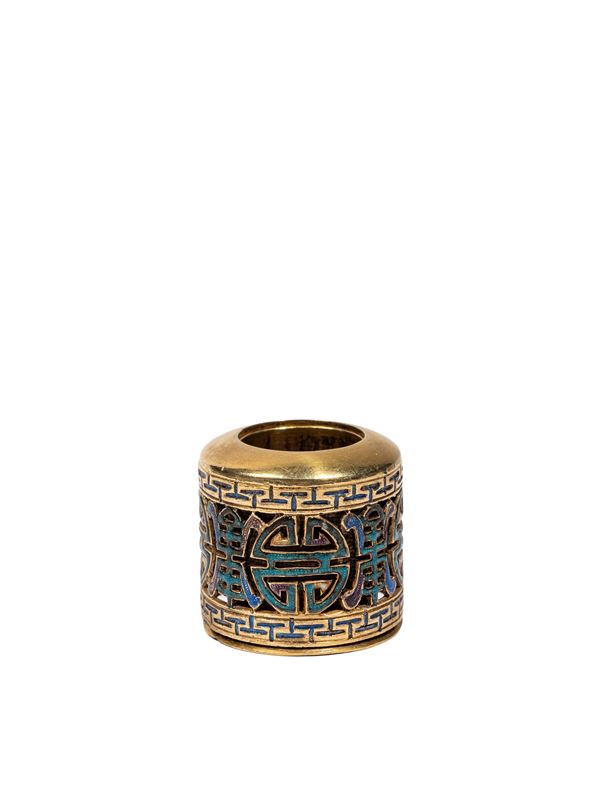 AN GILT AND ENAMELLED-BRONZE ARCHER RING