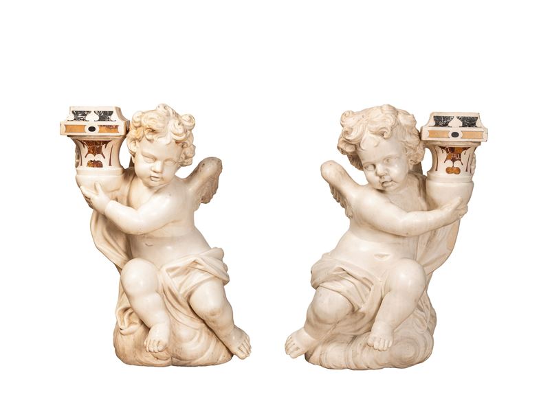 Ambito romano, Coppia di rari putti portacandele in marmo
