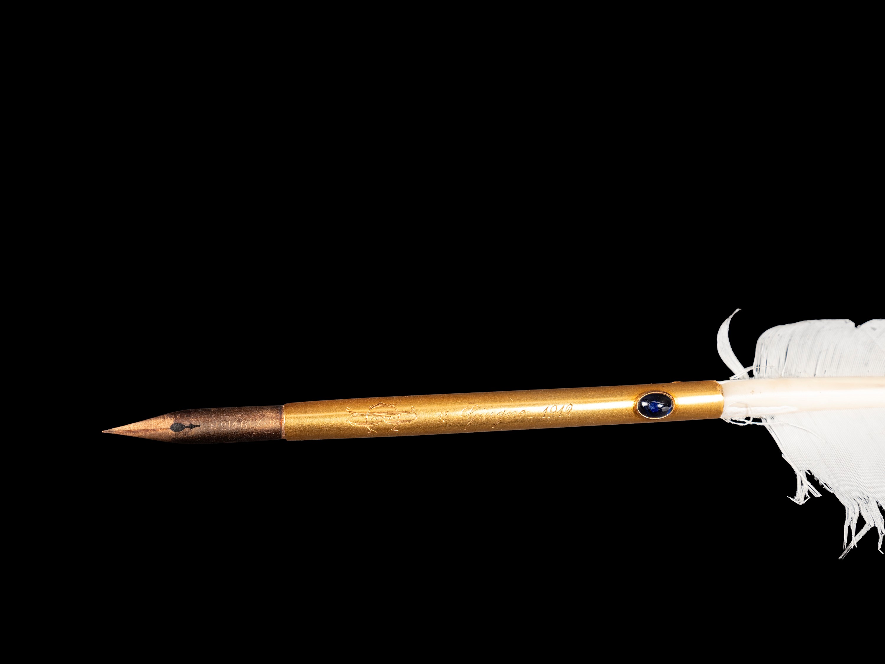 PENNA IN ORO A FORMA DI PIUMA