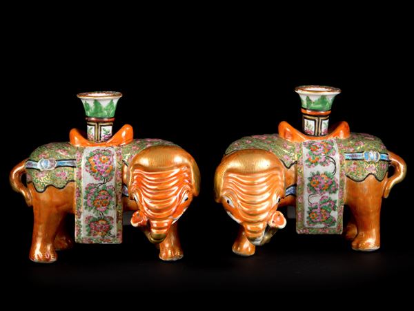 A PAIR OF FAMILLE ROSE ‘ELEPHANT AND VASE’ CANDLE HOLDERS