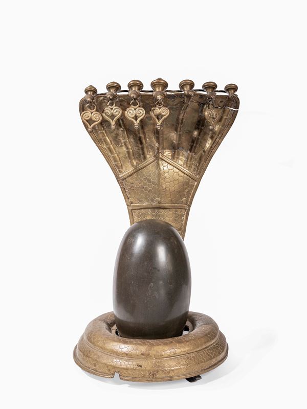 A LARGE RITUAL SCULPTURE OF A SHIVA LINGAM WITH NAGAS