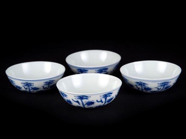 FOUR BLUE AND WHITE SMALL CUPS