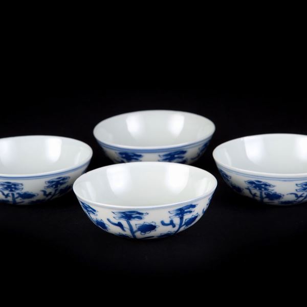 FOUR BLUE AND WHITE SMALL CUPS