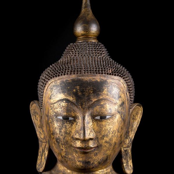GILT AND LACQUERED PAPIER-MACHE BUDDHA HEAD