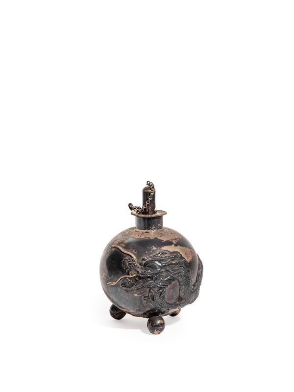 A SILVER OIL LAMP
