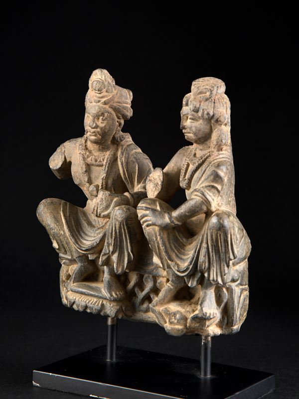 A SCHIST FIGURE OF HARITI AND PANCHIKA