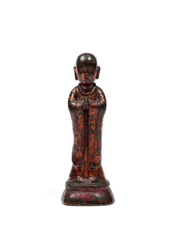 A LACQUERED-BRONZE FIGURE