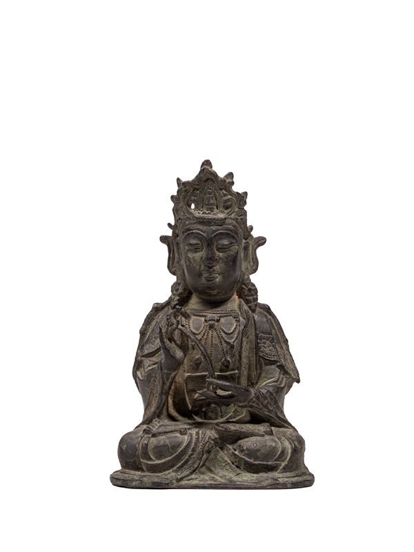 A BRONZE FIGURE OF AVALOKITESVARA