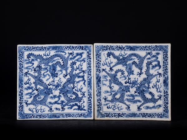 A PAIR OF BLUE AND WHITE TILES