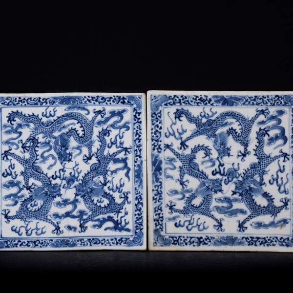 A PAIR OF BLUE AND WHITE TILES