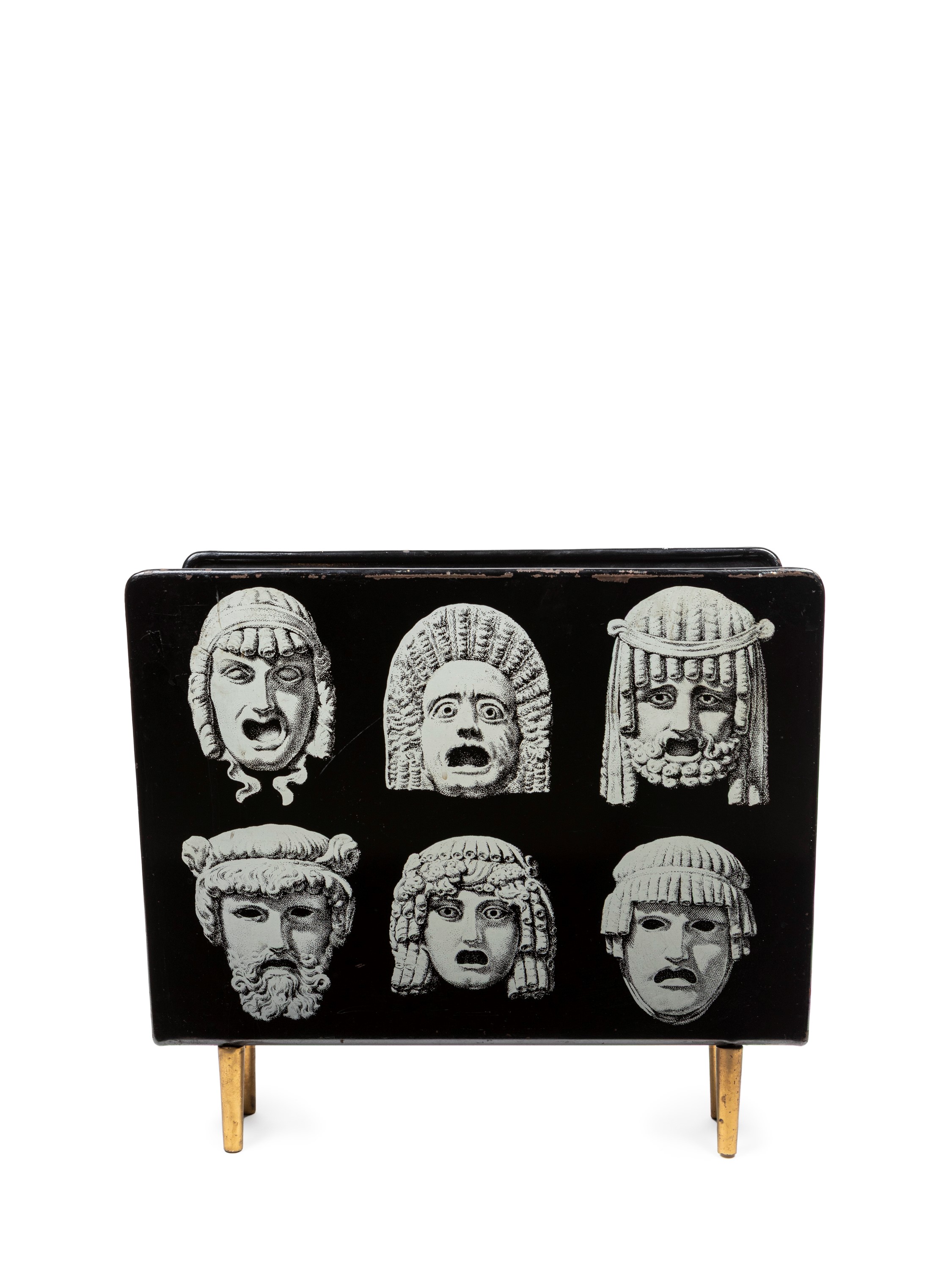 Piero Fornasetti - Portariviste “Maschere”, metallo laccato nero serigrafato