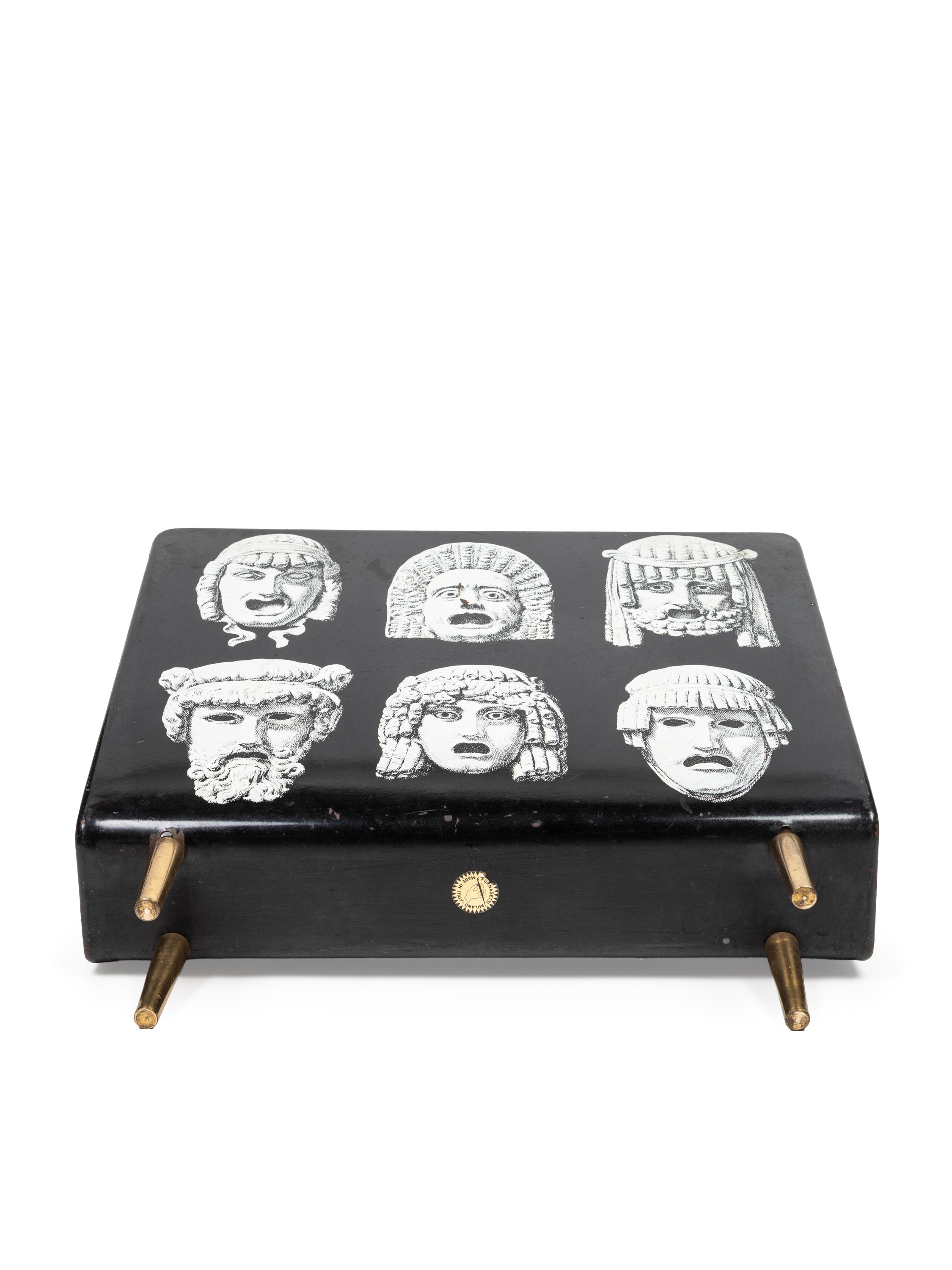 Piero Fornasetti - Portariviste “Maschere”, metallo laccato nero serigrafato