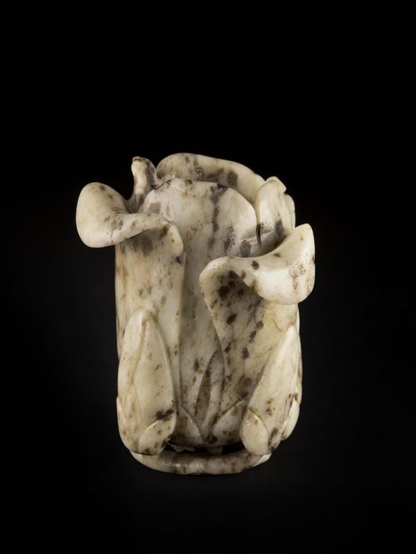 A MOTTLED JADE MAGNOLIA FORM VASE