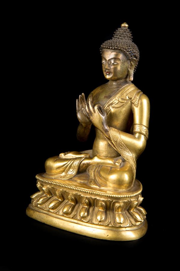 A GILT-BRONZE FIGURE OF BUDDHA IN DARMACHAKRAMUDRA