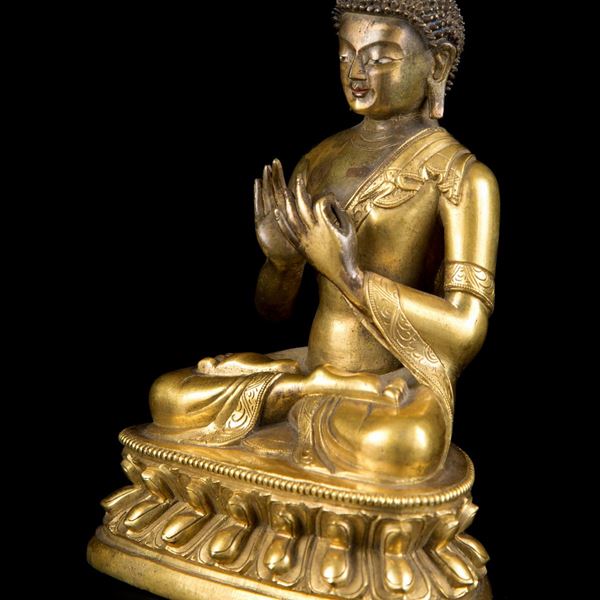 A GILT-BRONZE FIGURE OF BUDDHA IN DARMACHAKRAMUDRA