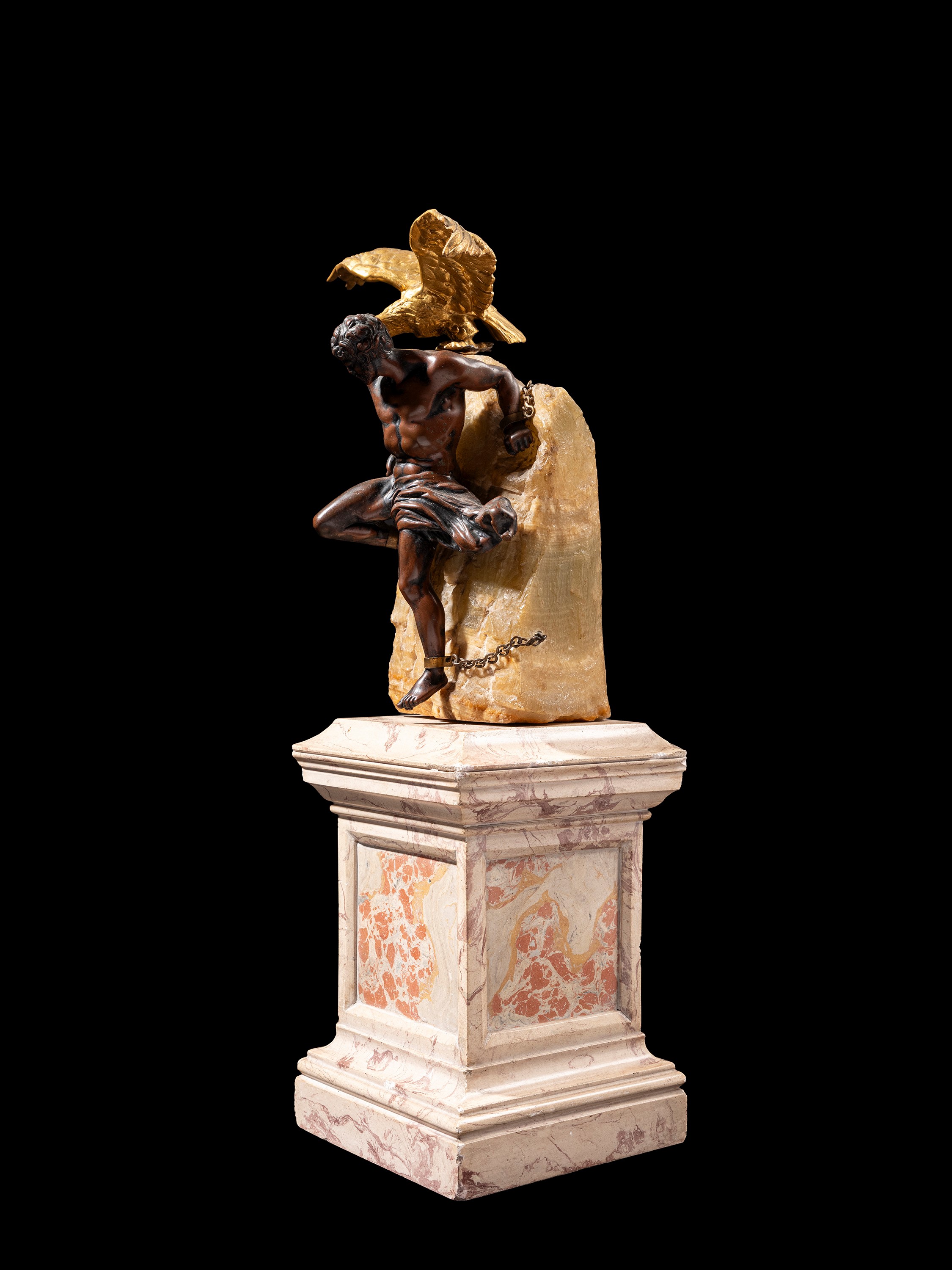 Francia, fine XIX secolo, Prometeo incatenato, bronzo a patina scura su piedistallo in scagliola