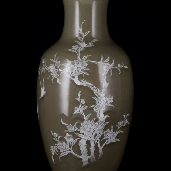 A CELADON WHITE SLIP DECORATED VASE