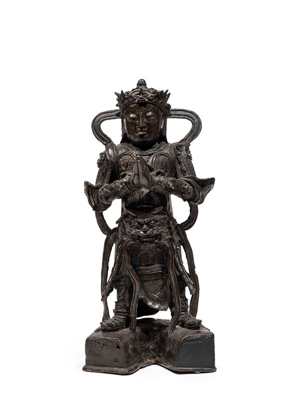 A BRONZE FIGURE OF WEITUO