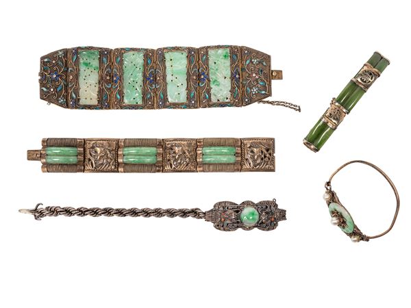 FIVE SILVER AND JADEITE BRACELETS
