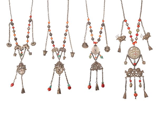 FOUR SILVER AND HARDSTONES NECKLACES