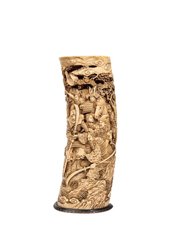 ☼A CARVED IVORY VASE IN HIGH RELIEF