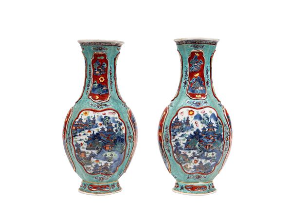 A PAIR OF PORCELAIN 'CLOBBERED' BALUSTER-SHAPED VASES