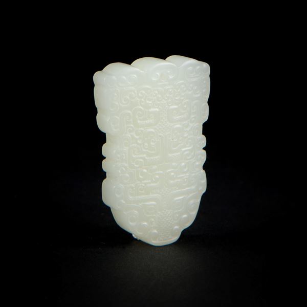 AN ARCHAISTIC WHITE JADE PENDANT