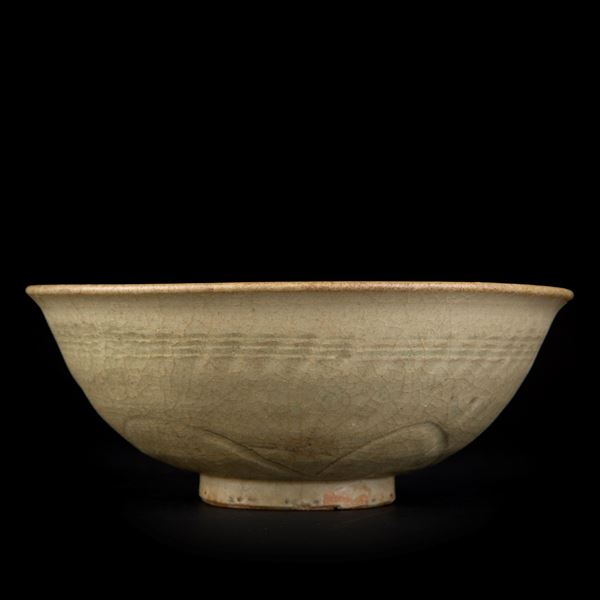 A CELADON CARVED MOLDED BOWL