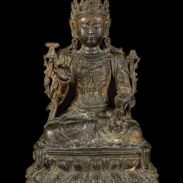 A GILT-BRONZE FIGURE OF A SEATED BUDDHA