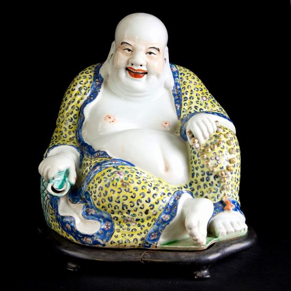 A PORCELAIN SMILING MARKED BUDDHA