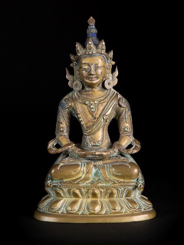 A BRONZE FIGURE OF BUDDHA