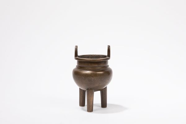 A BRONZE INLAID TRIPOD CENSER