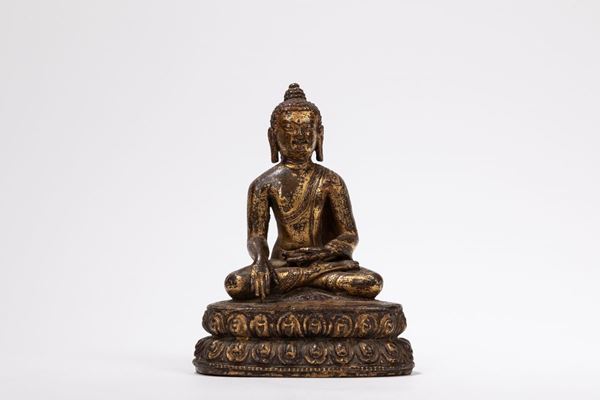 A GILT-COPPER BUDDHA