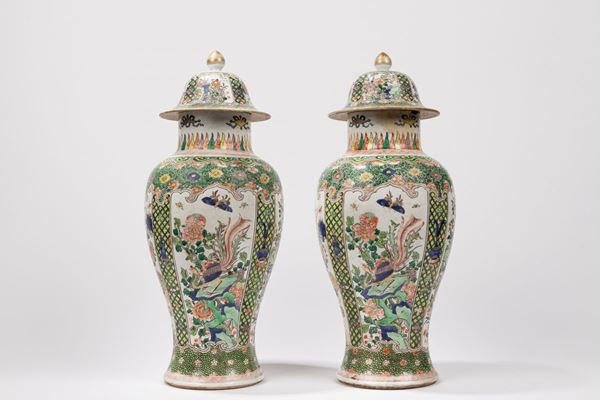 A PAIR OF FAMILLE VERTE PORCELAIN LIDDED VASES