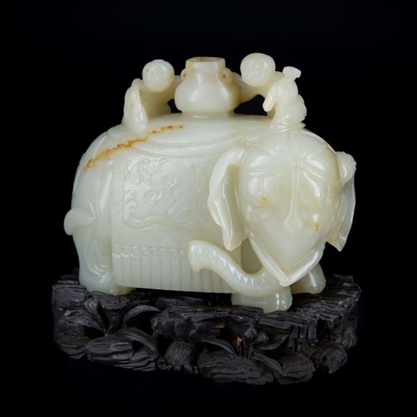 A FINE WHITE JADE RUSSET ELEPHANT AND BOYS GROUP